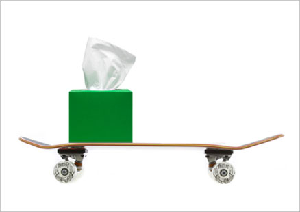 Skateboard with tissue box.